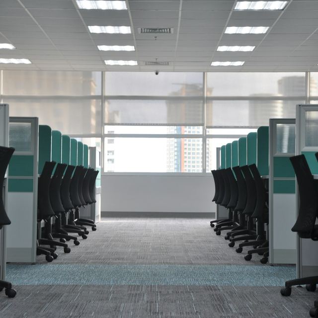 Clean office workspace with cubicles